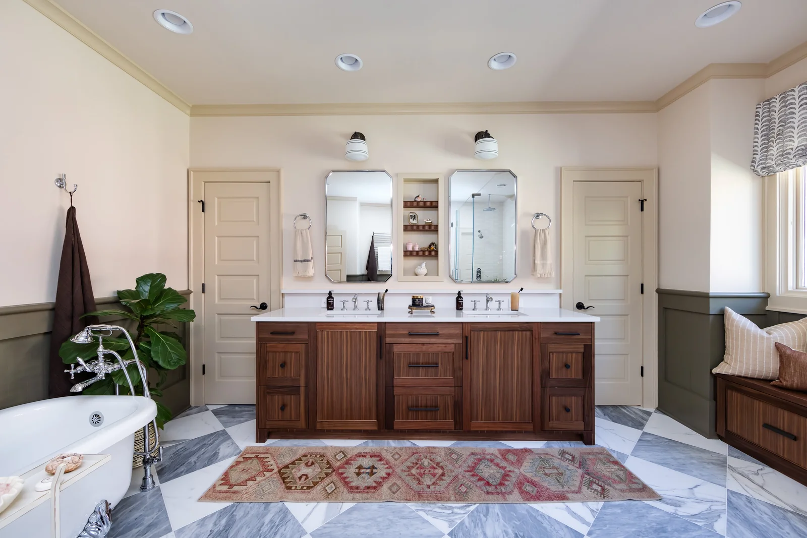 Bathroom remodel in Charlotte, NC, with a double vanity, freestanding tub, and patterned floor tile