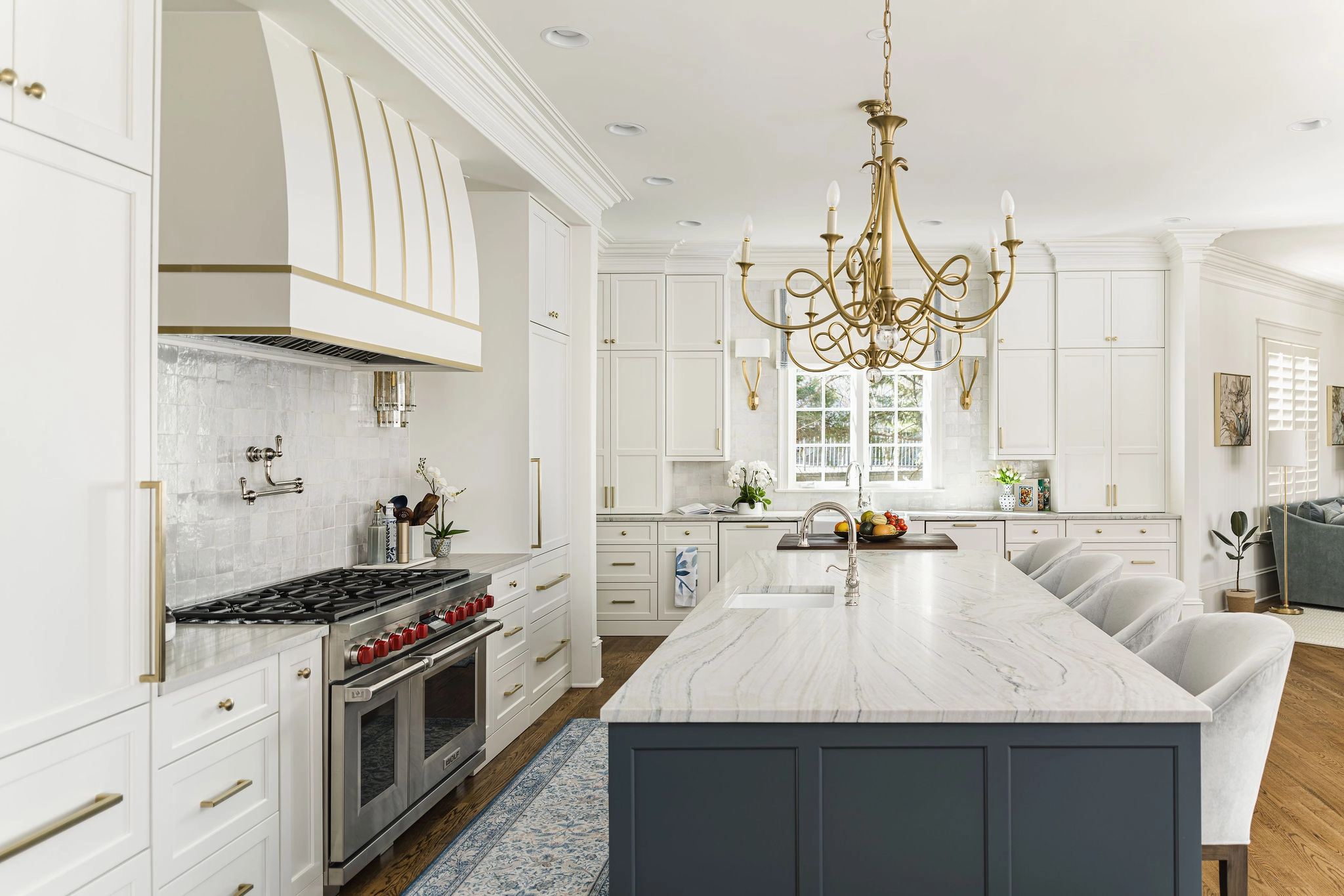 After: Longview Country Club kitchen with white cabinets, a blue island, and gold accents
