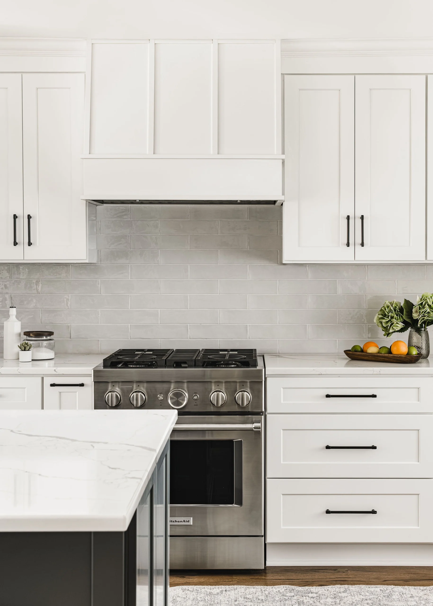 First-floor remodel in Old Georgetown, white shaker kitchen cabinets, light gray subway tile backsplash