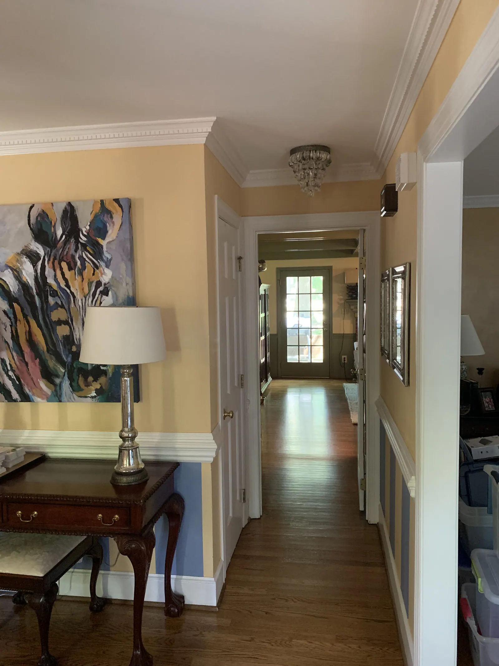 Whole-home remodel in Providence Plantation with a hallway, hardwood floors, and wainscoting