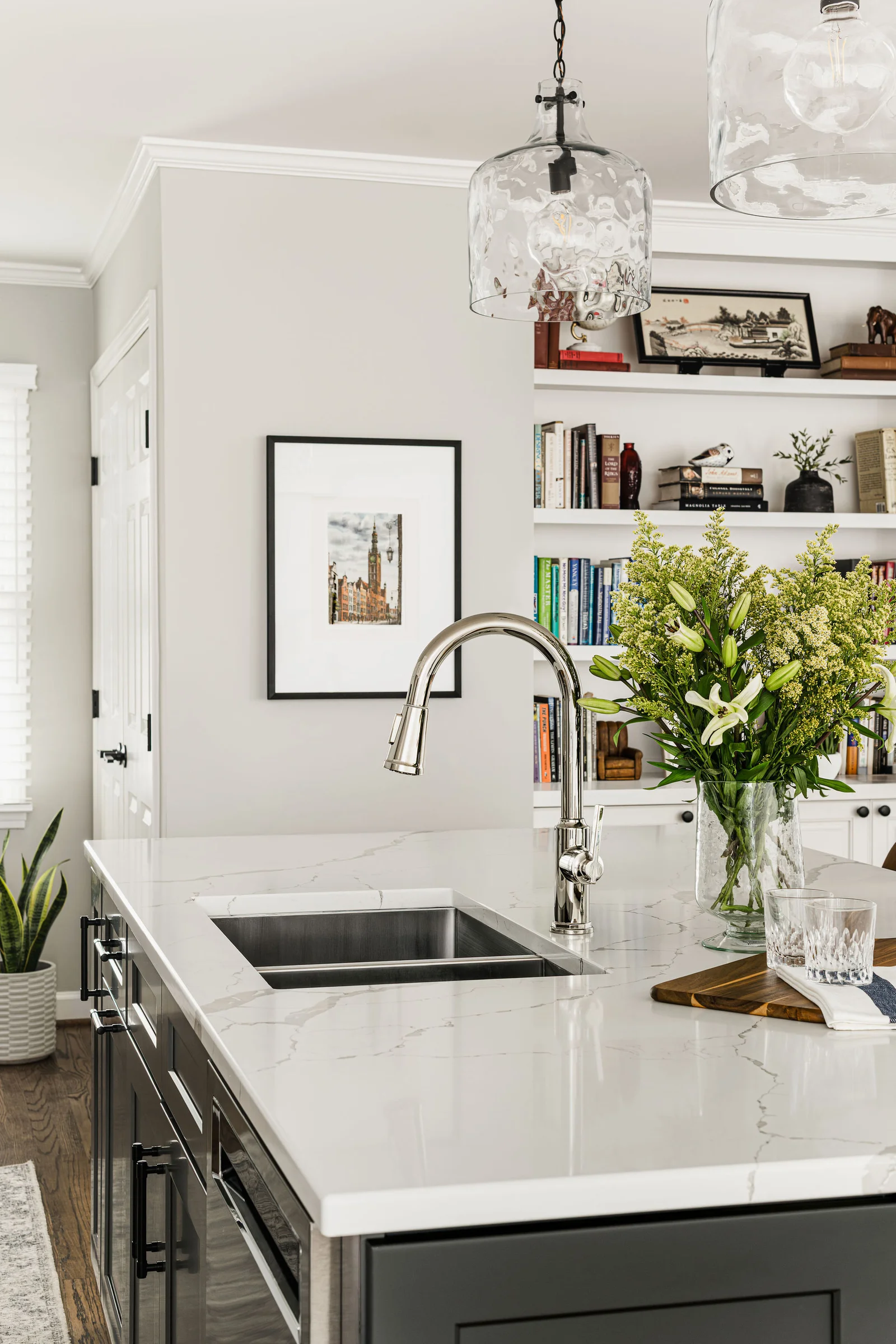First-floor remodel in Old Georgetown with a kitchen island, quartz countertop, and stainless steel sink