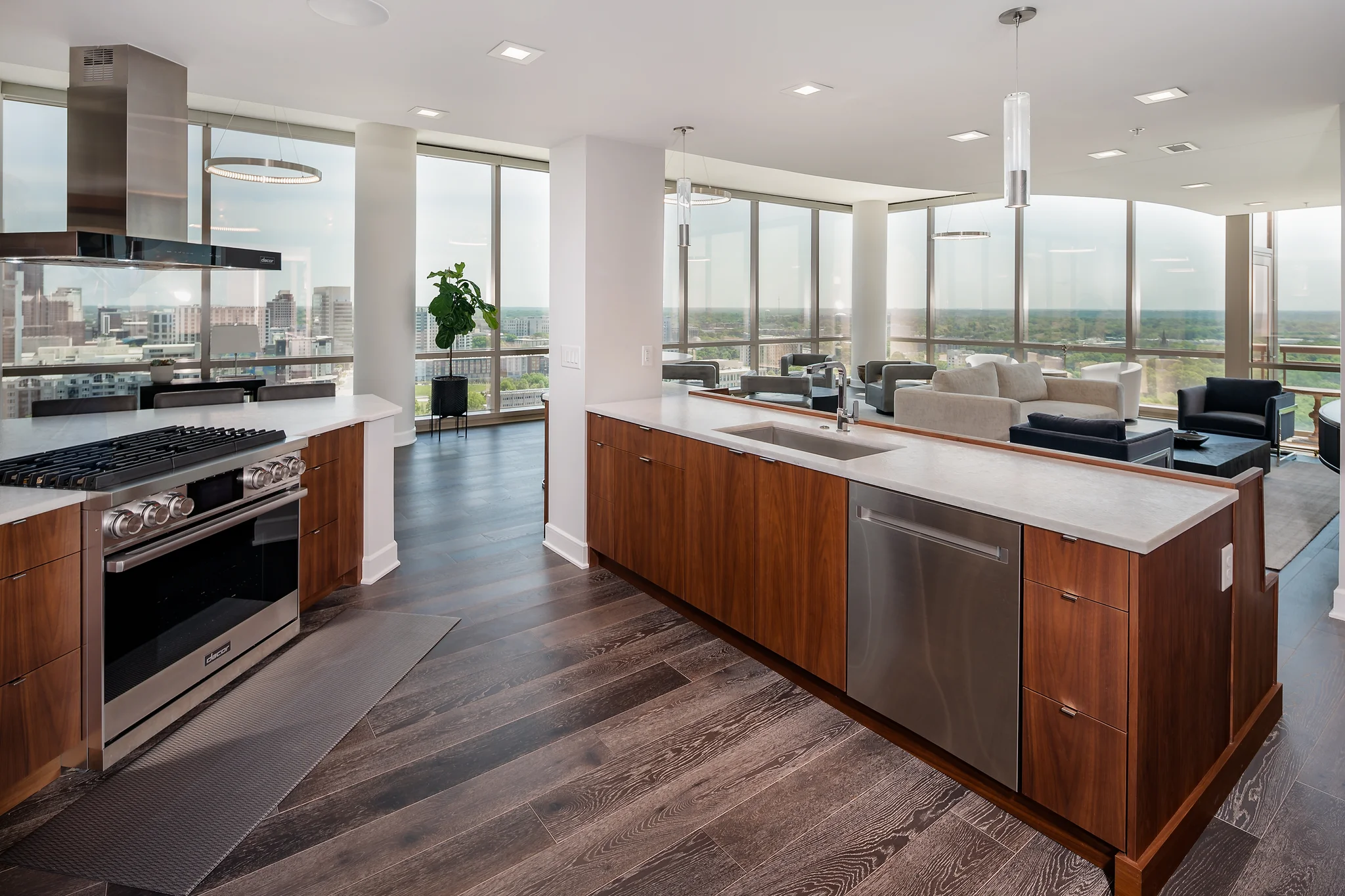 Penthouse kitchen remodel at The Arlington with wood cabinets, white counters, and city views
