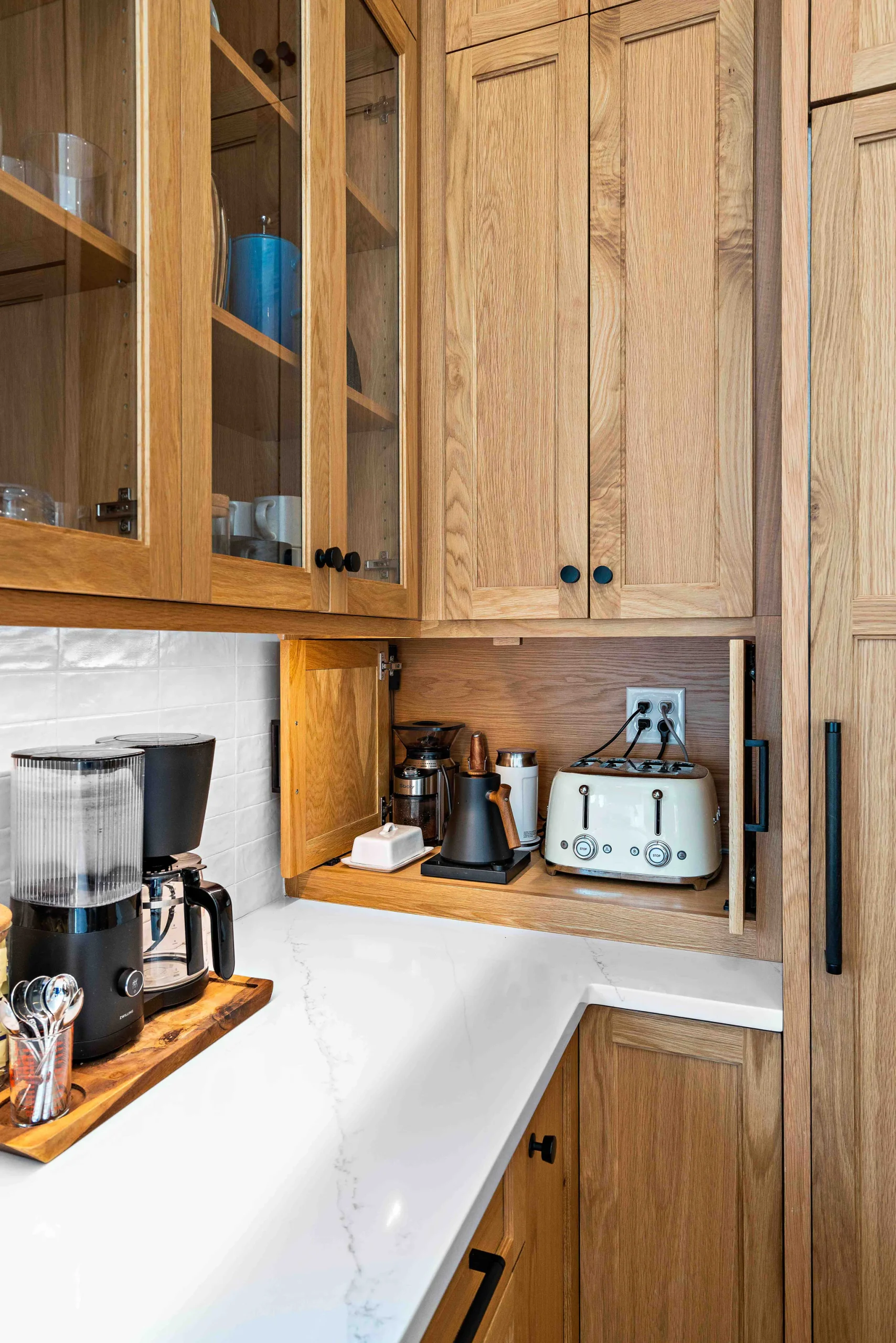 Kitchen remodel in Heydon Hall with oak cabinets, appliance garage, and white quartz countertop