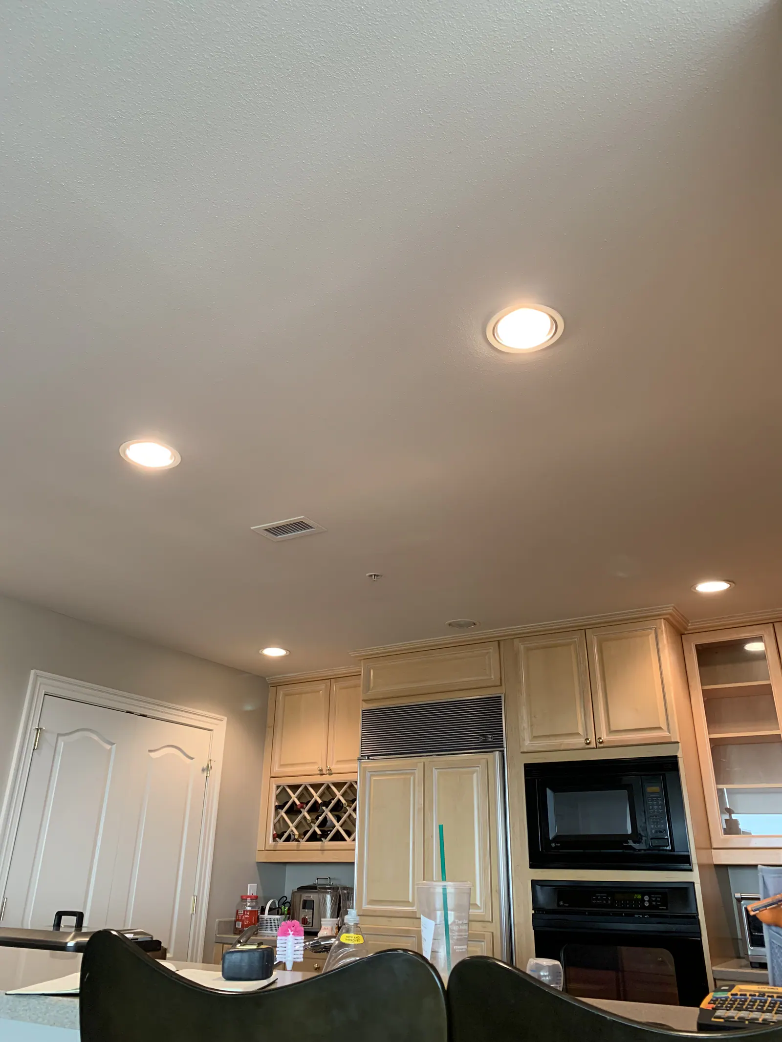 Penthouse kitchen remodel at The Arlington, recessed lighting, and light wood cabinetry