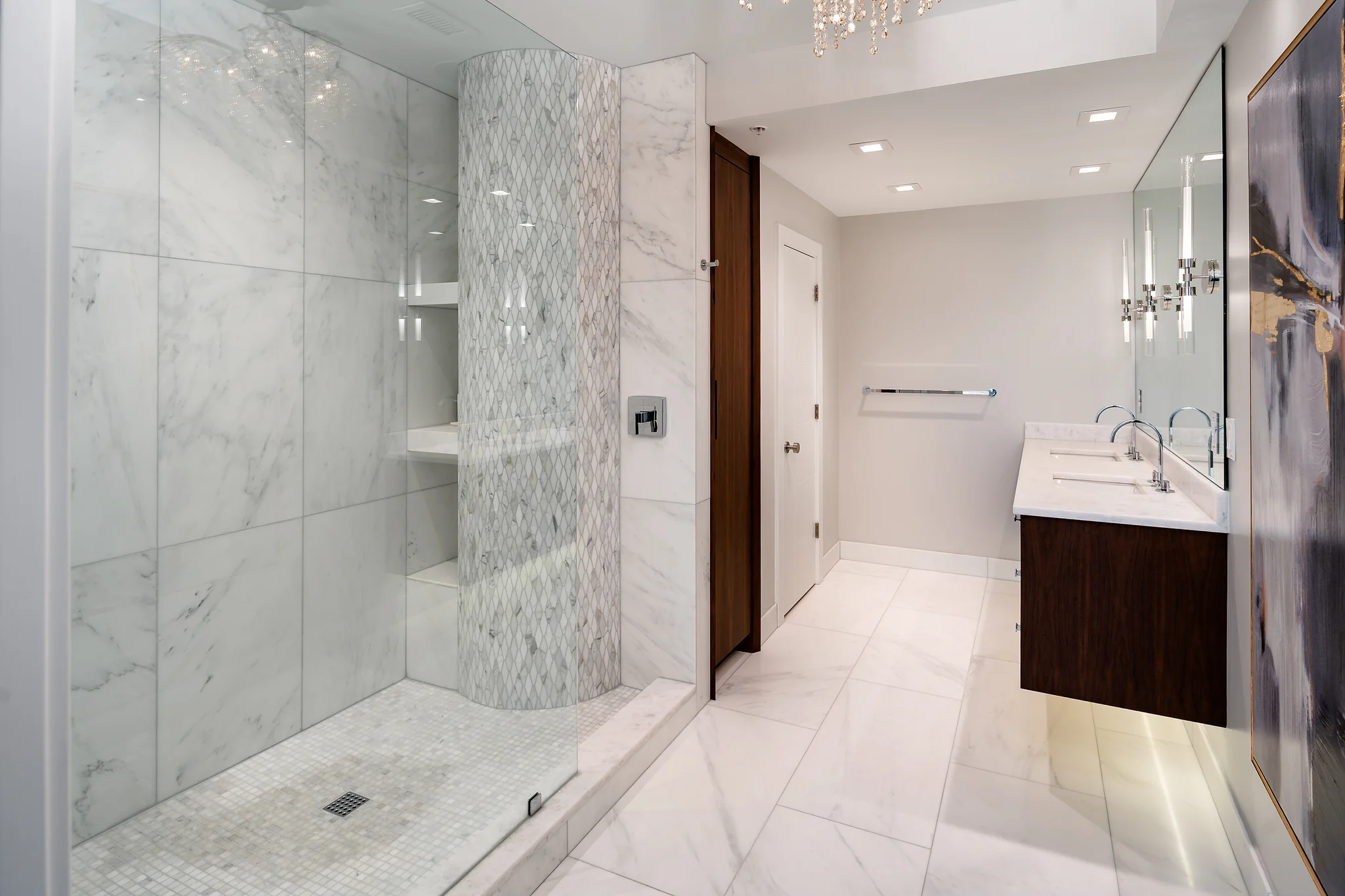 Penthouse bathroom remodel at The Arlington with a walk-in shower, freestanding vanity, and large mirror