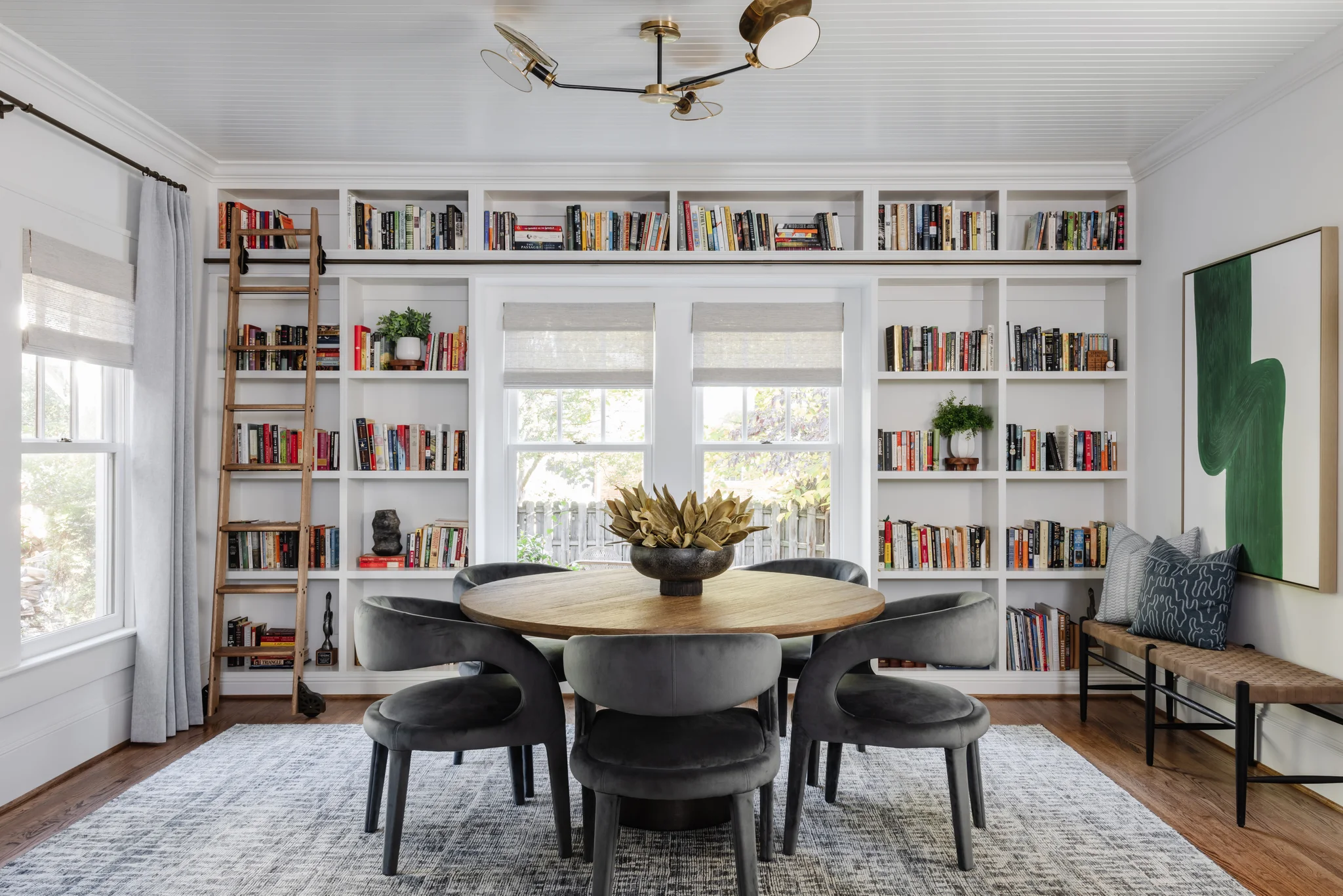 Whole-home remodel in Historic Dilworth, dining room with built-in bookshelves and a round wood table
